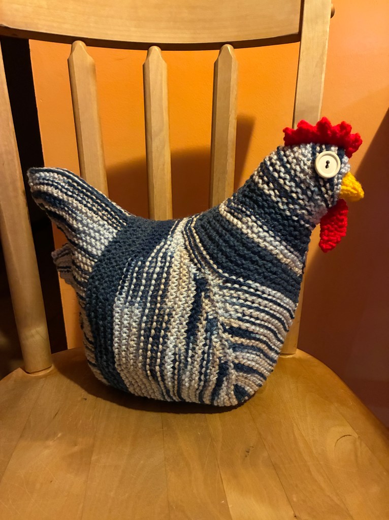 dark blue, light blue and cream colored knit chicken